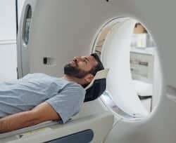 Man getting an MRI in atlanta at AICA imaging center