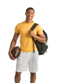 Young athlete avoiding injuries and orthopedic surgeons holding football and backpack